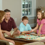 Family playing a board game together