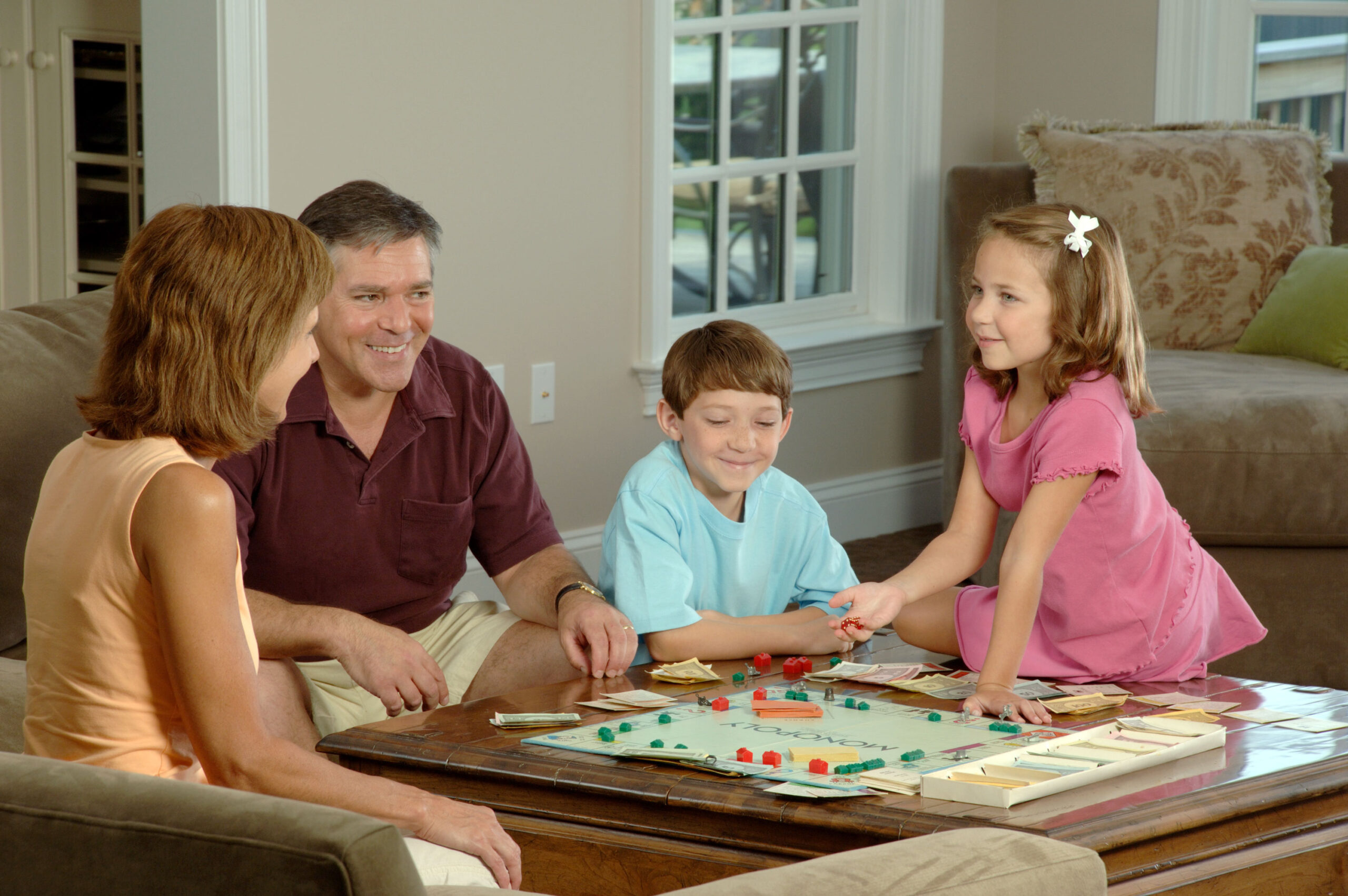 Family playing a board game together